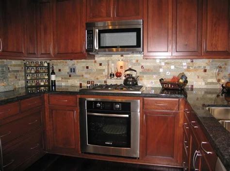 Subway tile is a classic choice for a kitchen backsplash. backsplash with cherry cabinets | Kitchen Tile Backsplash ...