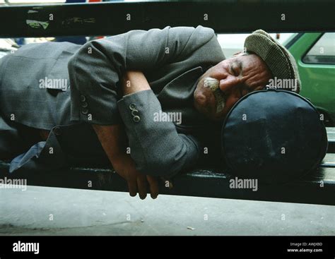 Man Sleeping On Park Bench Stock Photo Alamy