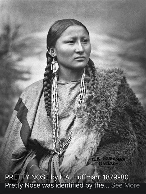 An Old Native American Woman With Long Braids