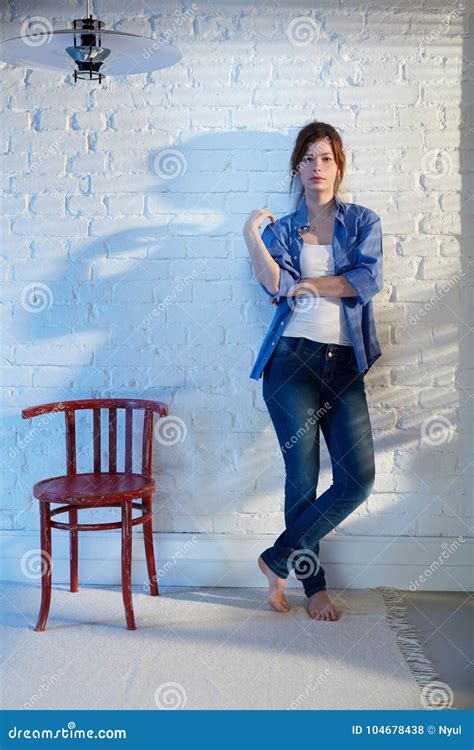 Young Woman Leaning Against Wall Stock Photo Image Of Beautiful Home