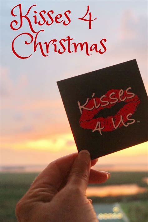 Someone Is Holding Up A Card With The Words Kisses 4 Christmas Written
