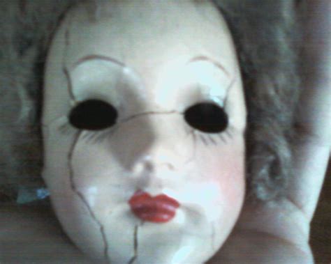 A Porcelain Doll Head With No Eyes And Cracks On Her Face Rmildlycreepy
