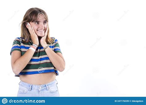 Girl Holding Her Hands On Her Neck Smiling And Looking At The Camera Isolated Over White