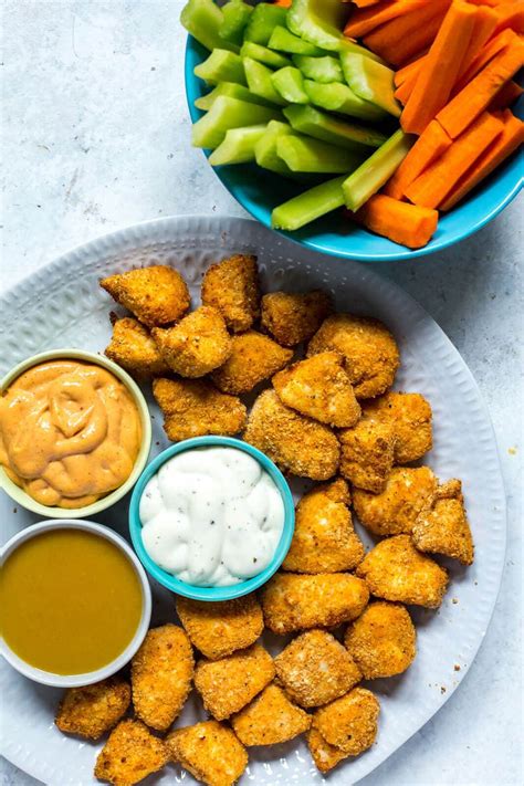Fry the chicken, in batches if needed, until golden brown and cooked through, a couple minutes per side. Super Easy Airfryer Homemade Chicken Nuggets - The Girl on ...
