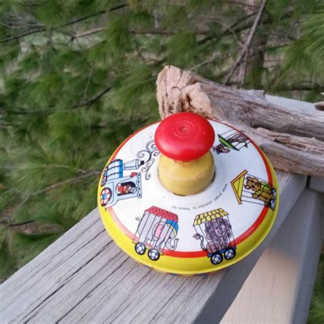 vintage ohio art metal spinning top with circus train graphics etsy