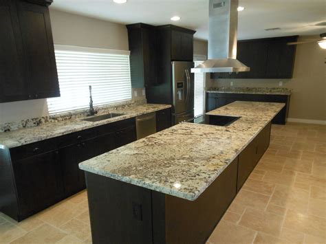 Enjoy this cabinet in your home today. espresso brown shaker cabinets with juparana delicates ...