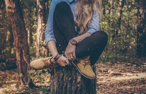 wallpaper id 229760 woman wearing watch sitting on tree stump in the forest wearing boots