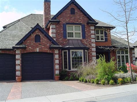 Designate 60% of the facade for the dominant color, use a secondary hue for 30%, and paint the remaining 10% in an accent color. Purple & Orange Brick Exterior | Exterior paint colors for ...