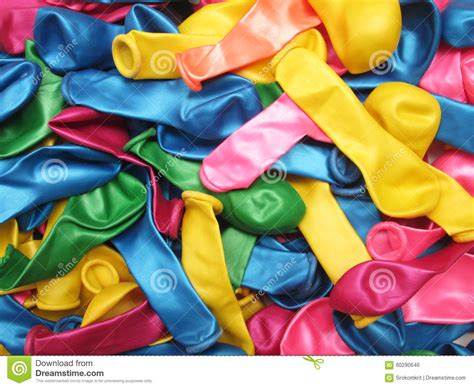 Colorful Vibrant Background Of A Pile Of Deflated Party Balloons In The
