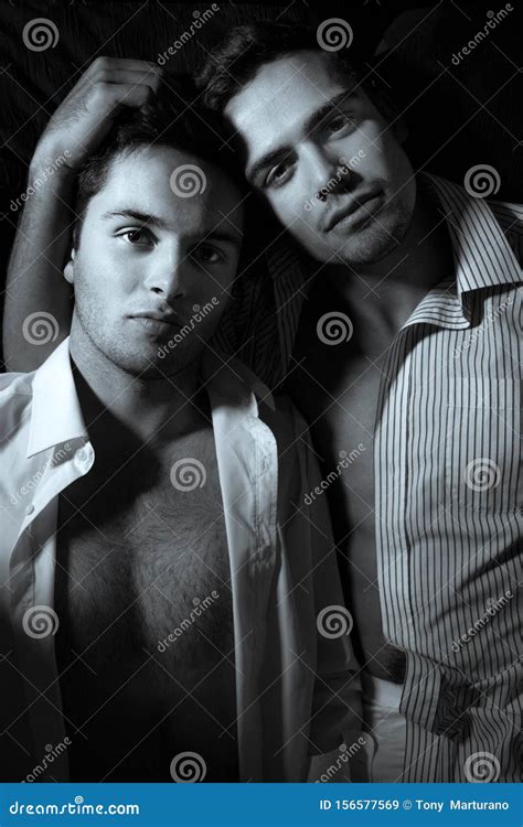 Gay Male Couple Lying In Bed And Both Looking At The Camera Stock Image Image Of Husband Male