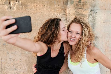 Sporty Mom And Daughter Taking A Selfie By Stocksy Contributor Ivan