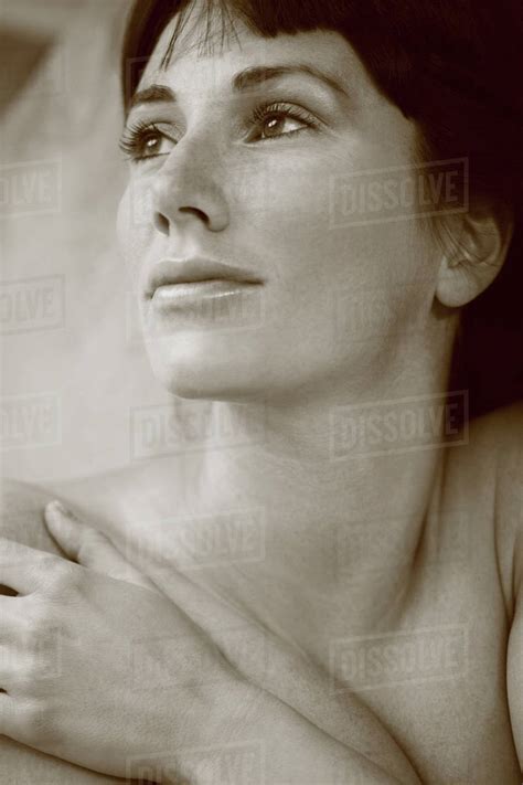 Nude Caucasian Woman Looking Up Stock Photo Dissolve