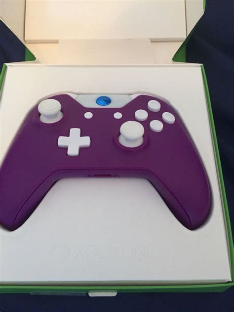 Purple Xbox One Controller With White Trim And A Metallic Blue Guide