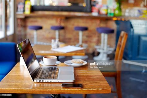 Laptop On Table In Coffee Shop High Res Stock Photo Getty Images