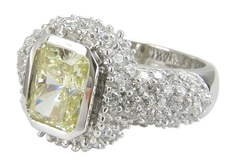 Ainsley 7 Carat Radiant Emerald Cut Bezel Set Cubic Zirconia Halo Pave