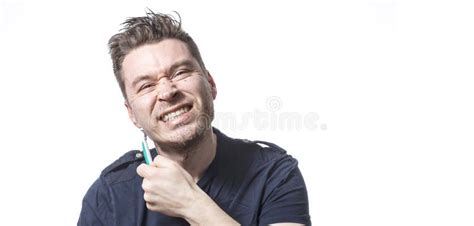 Portrait Of Man Getting Hurt While Shaving With A Razor Stock Photo