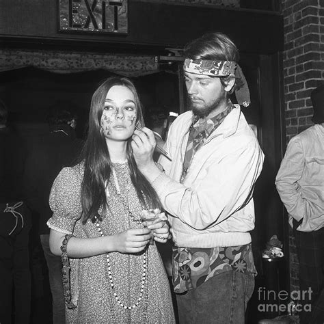 Hippie Woman Getting Her Face Painted By Bettmann