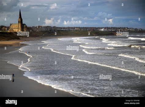 Surfers On Long Sands Beach Tynemouth North East England Stock Photo