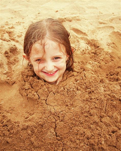 A Little Girl Buried In The Sand Photograph By Derrick Neill Pixels