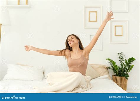 A Beautiful Woman Wakes Up In Her Bed She Smiles And Stretches Green