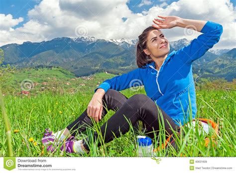 Portrait Of Young Woman Hiking With Beautiful Mountain