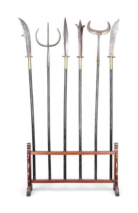 A Group Of Six Chinese Steel Weapons On A Stand 20th Century Christies