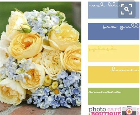 A Wedding Bouquet With Yellow Roses And Blue Hydrangeas Is Shown In