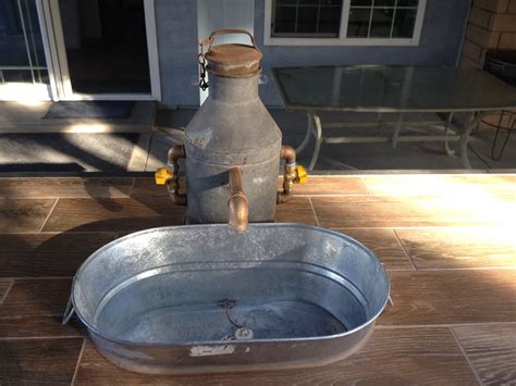 Finding a good faucet isn't an easy job. Outdoor Kitchen - Custom made faucet with galvanized tub ...