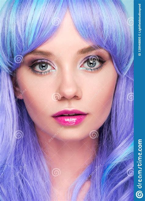 Close Up Portrait Of Sensual Young Woman With Blue Hair Looking At