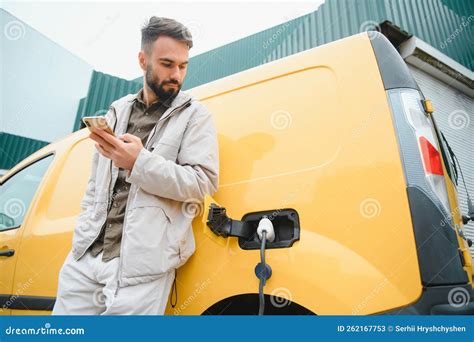 Man Charging His Electric Car Stock Image Image Of Electrical Plug