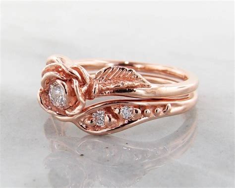 This delicate pavé set, rounded wire wedding ring matches beautifully with many different engagement ring options, you can wear one or two (one on each side of the engagement ring), either option will look beautiful. 2020 Popular Rose Gold Wedding Bands Sets