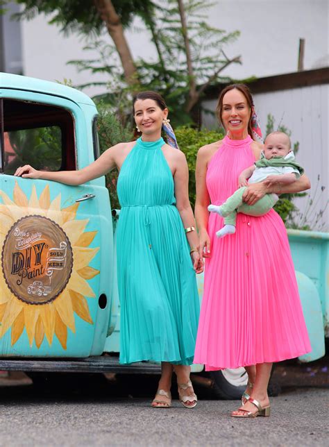 Sydne Style Wears Pink Pleated Midi Dress With Baby And Friend Sydne