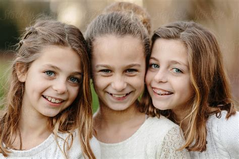 Close Up Of Three Sister Standing Together By Stocksy Contributor Jakob Lagerstedt Stocksy