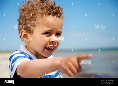 Adorable Little Kid Pointing At Something Interesting Outdoors Stock