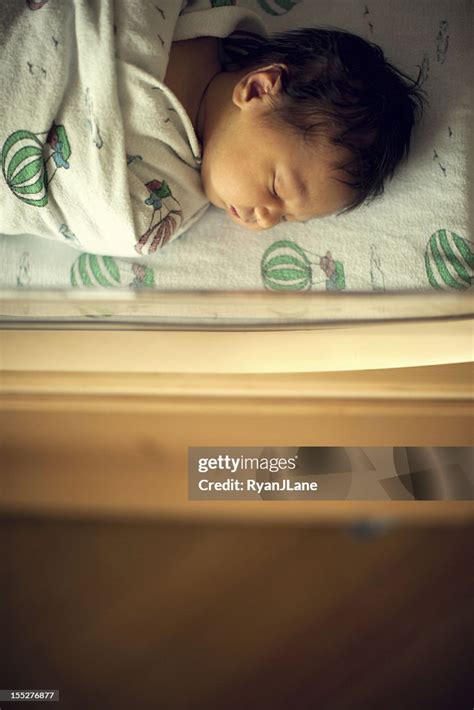 Newborn Sleeping Baby Boy In Hospital Bassinet High Res Stock Photo