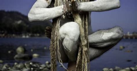 A Naked Sadhu In His Yoga Practice On The Banks Of The Ganges In Haridwarnear The Indian