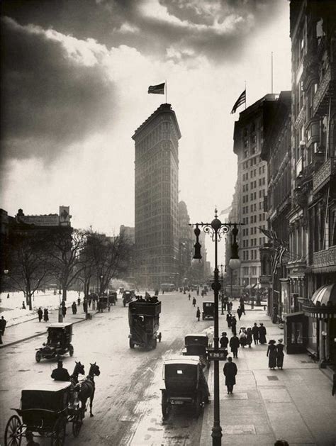 Locals Walk The Streets Of Madison Square Near The Flatiron Building In