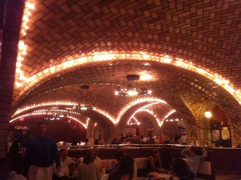 Through its status as a transportation and architectural icon. The Oyster Bar in Grand Central Station, NY. Crappy photo ...