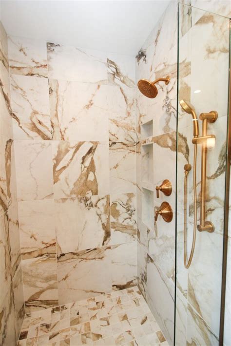 Gold And White Marble Look Shower Tile In White Bathroom With Gold