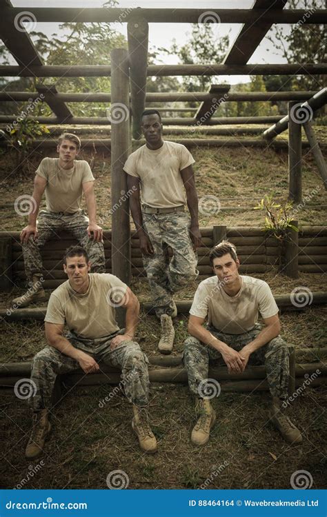 Soldiers Sitting On The Obstacle Course In Boot Camp Stock Photo
