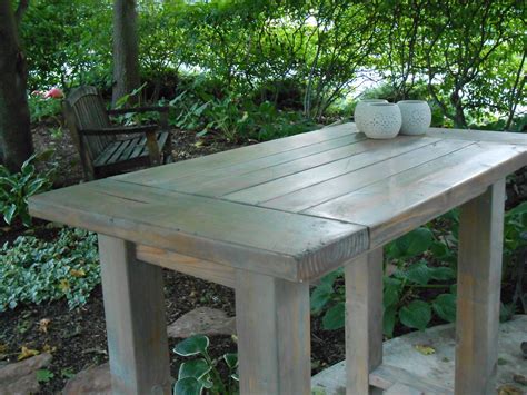 Try looking for a cart at a resale shop or garage sale and then refinish it or go with the industrial look, and add a countertop of your choice. Ana White | Farmhouse table modified to become an outdoor kitchen Island - DIY Projects