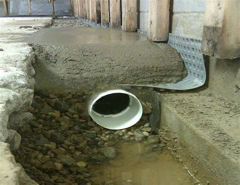 To protect your basement from water, you will need to dig all the outer perimeter of the basement all the way down to the base of the foundation. Installing a French Drain in Taylor MI | Everdry Michigan