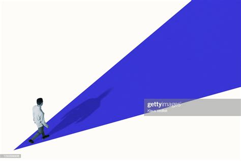 High Angle View Of Young Man Walking On Blue Ramp High Res Stock Photo