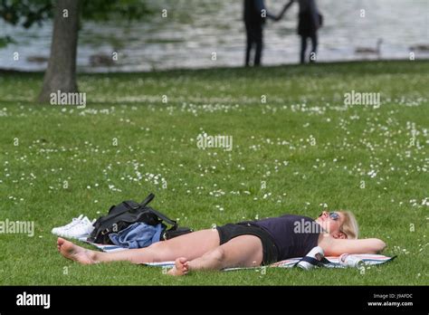 London Uk St June A Woman Sunbathing In Hyde Park On A Warm