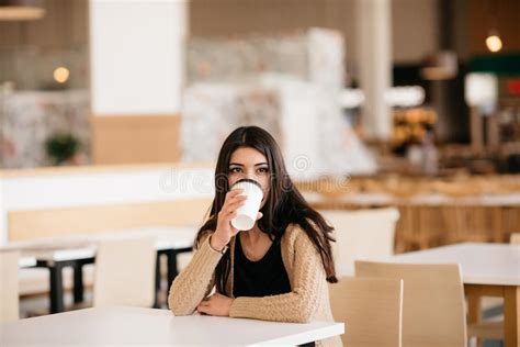 Shot Of A Beautiful Woman Drinking Coffee In Cafe Stock Photo Image