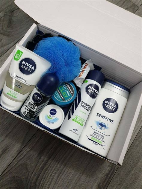 An Open Box Containing Men S Grooming Products On A Wooden Floor With A