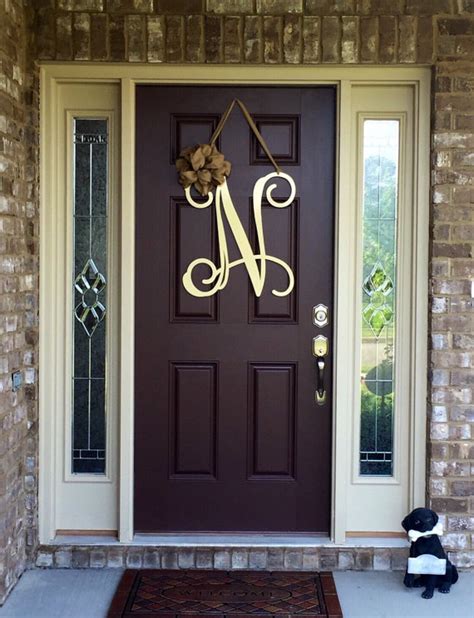 Check out our letter decor selection for the very best in unique or custom, handmade pieces from our home décor shops. Metal Initial door wreath w/ ribbon, Front Door Wreaths ...
