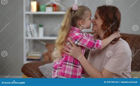 Side View Loving Mother Rubbing Noses With Daughter Kissing Kid