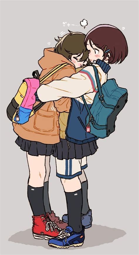 Two People Hugging Each Other With Backpacks On Their Back And One