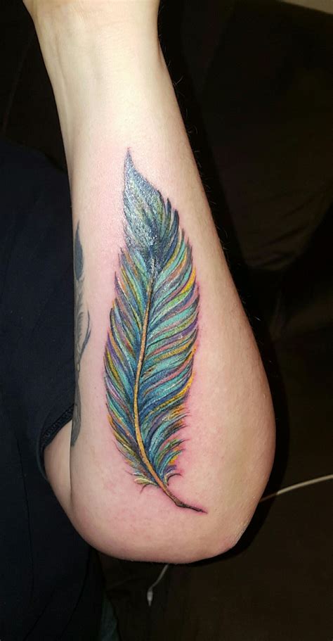 Ideally they are recommended behind the ear but finger is also a good choice. Colorful feather tattoo | Feather tattoo colour, Feather ...